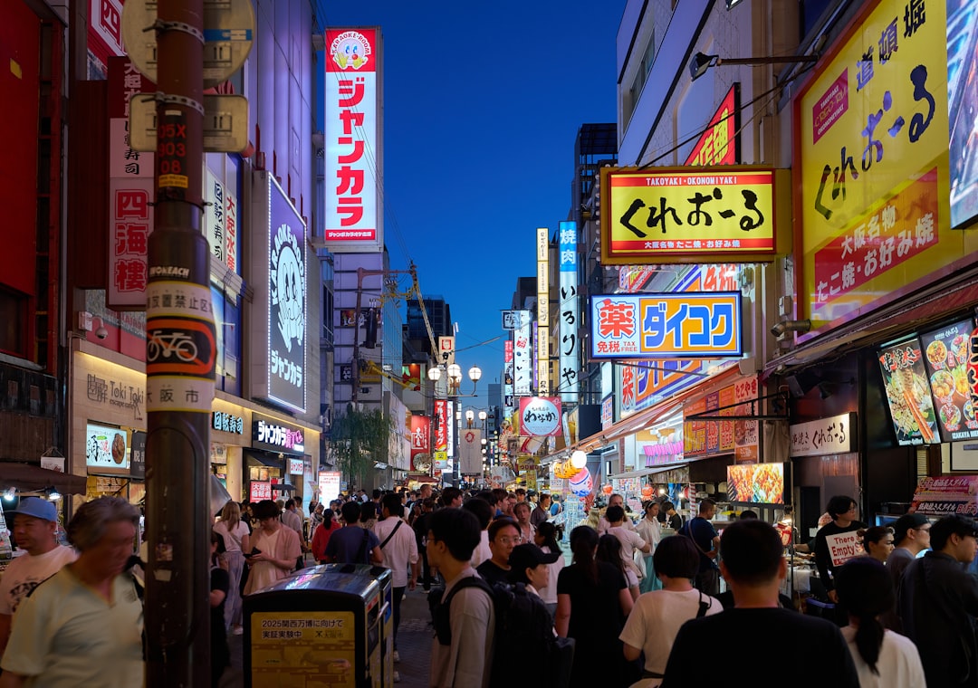 A crowded city street filled with lots of people